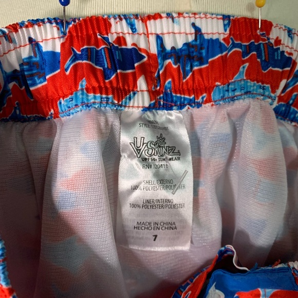 Shark print red and blue UV Skins boys swim trunks. - Picture 3 of 4
